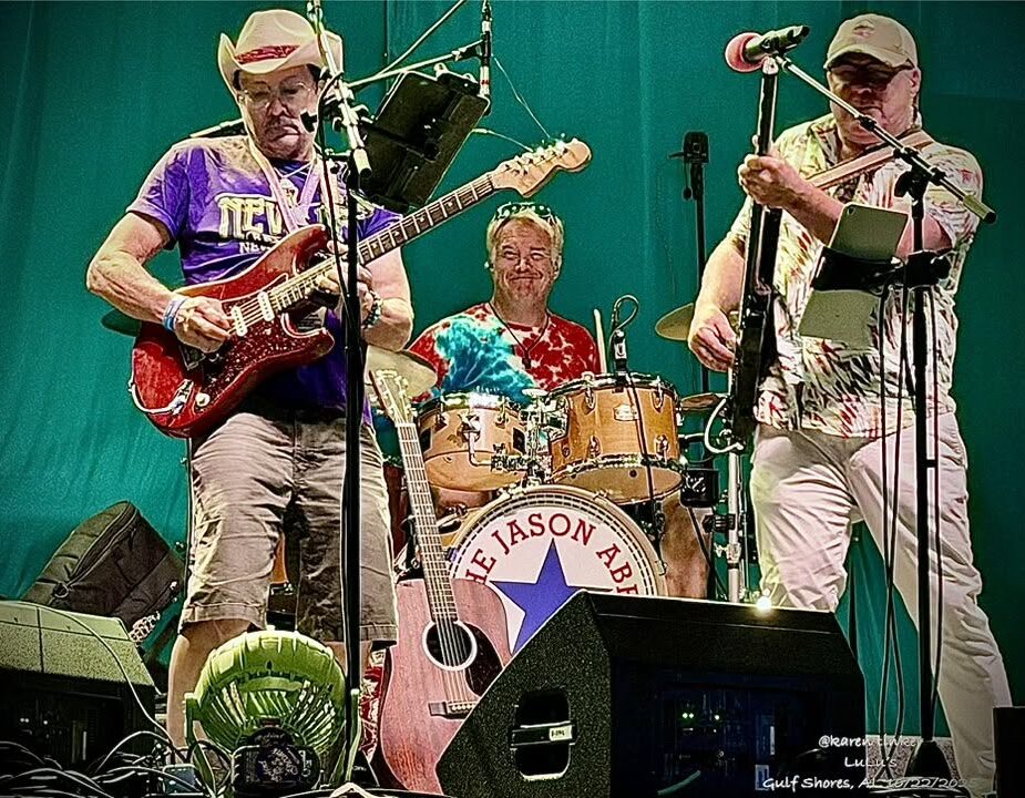 8 Smiling bass player performing during an outdoor live show.